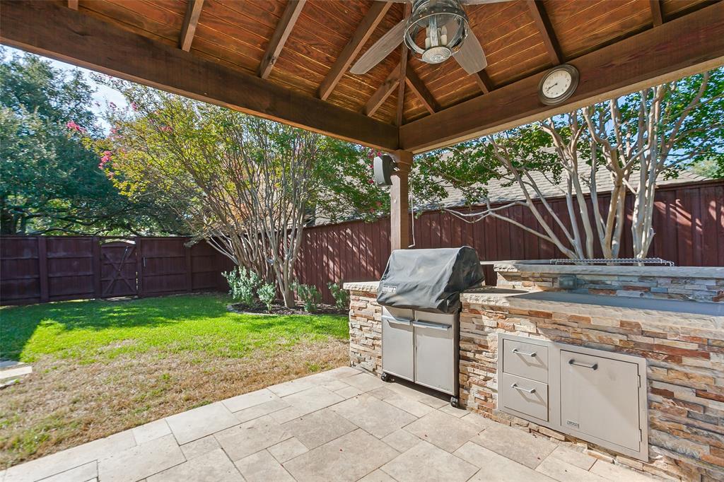 Pergola with built-in grill and mini-fridge