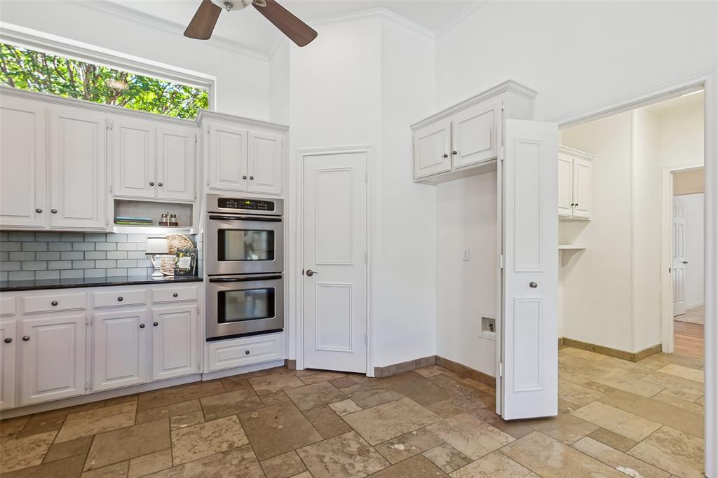 Laundry room is conveniently located between kitchen and SE hallway