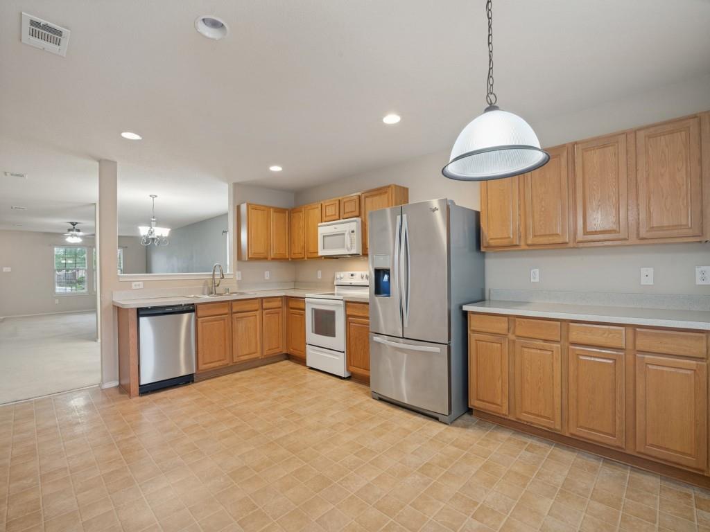 Plenty of counter-top space, extensive cabinetry, and double sink.