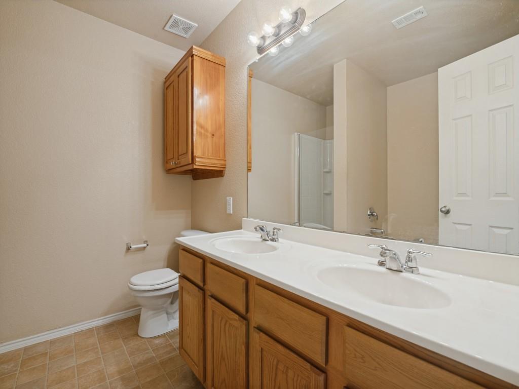 Dual-sink vanity, generous counter space and built-in storage.