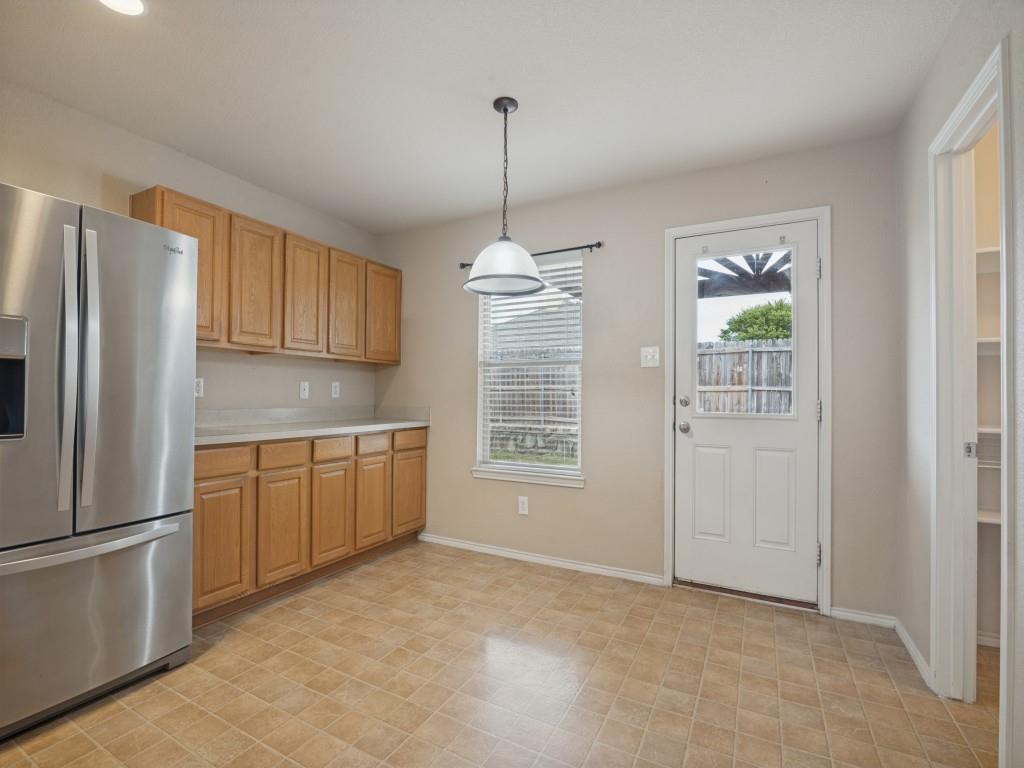 Bright breakfast area with backyard access and nearby walk-in pantry.