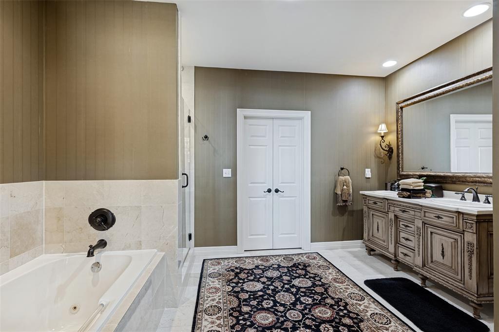Beautifully appointed bathroom with dual vanities and custom cabinetry.