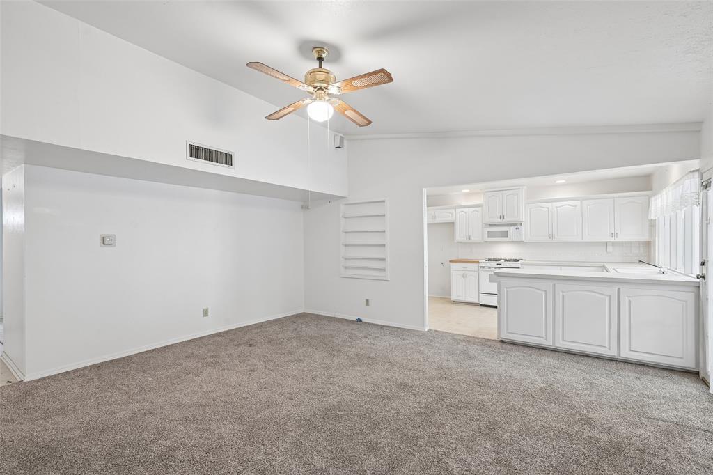 Vaulted ceilings carry from the living room straight into the kitchen. Vaulted ceilings carry from the living room straight into the kitchen.