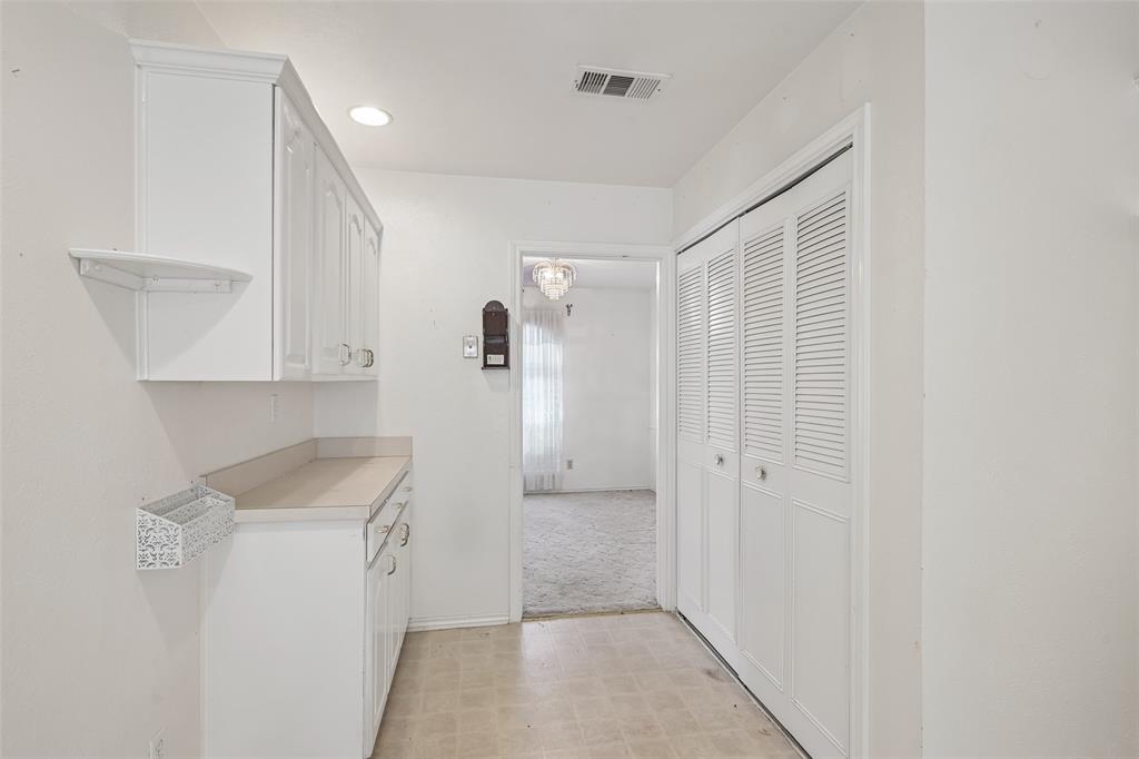 Built-in cabinets and counter space add extra storage.