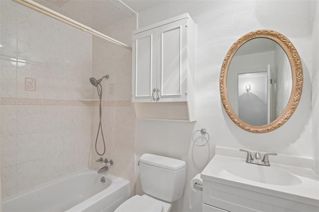 Hall bath with a tub-and-shower combination.