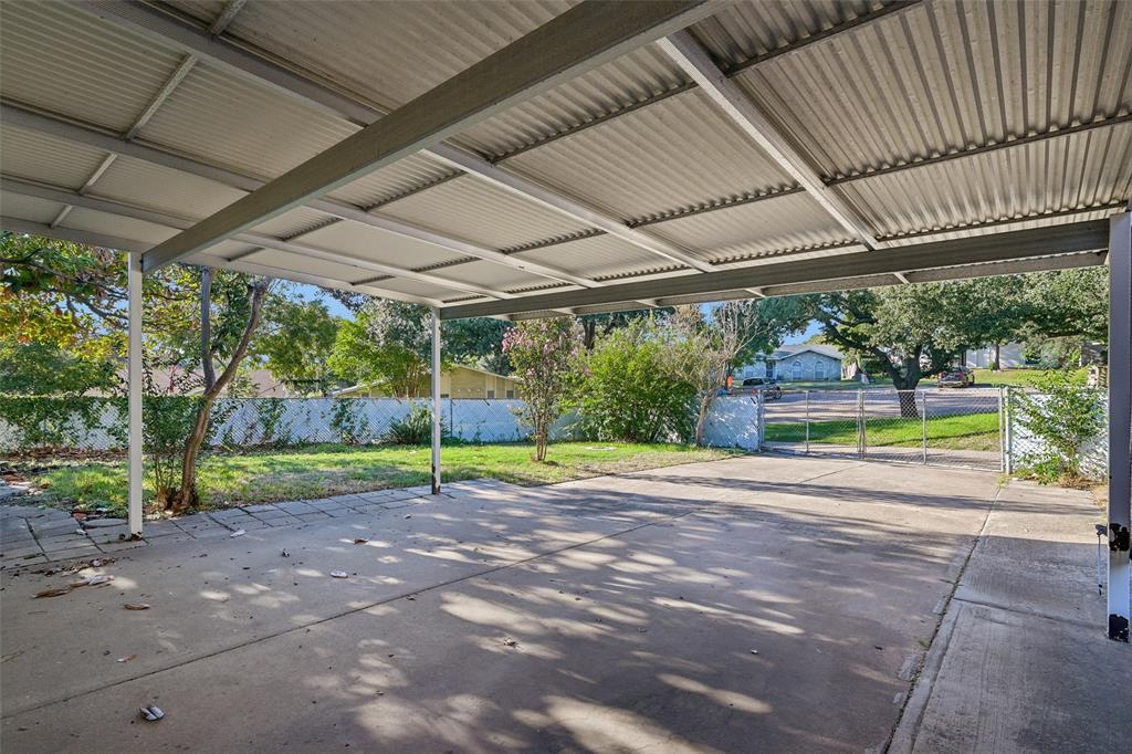 A covered patio looks out over the big corner-lot backyard. A covered patio looks out over the big corner-lot backyard.