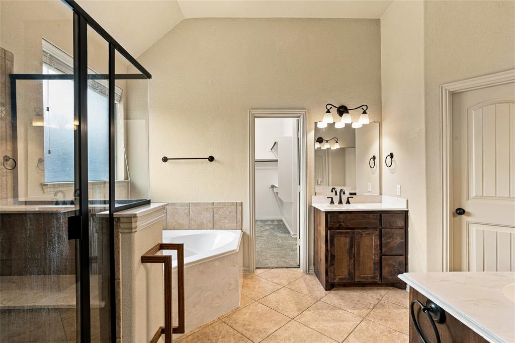 Ensuite primary bath with separate vanities.