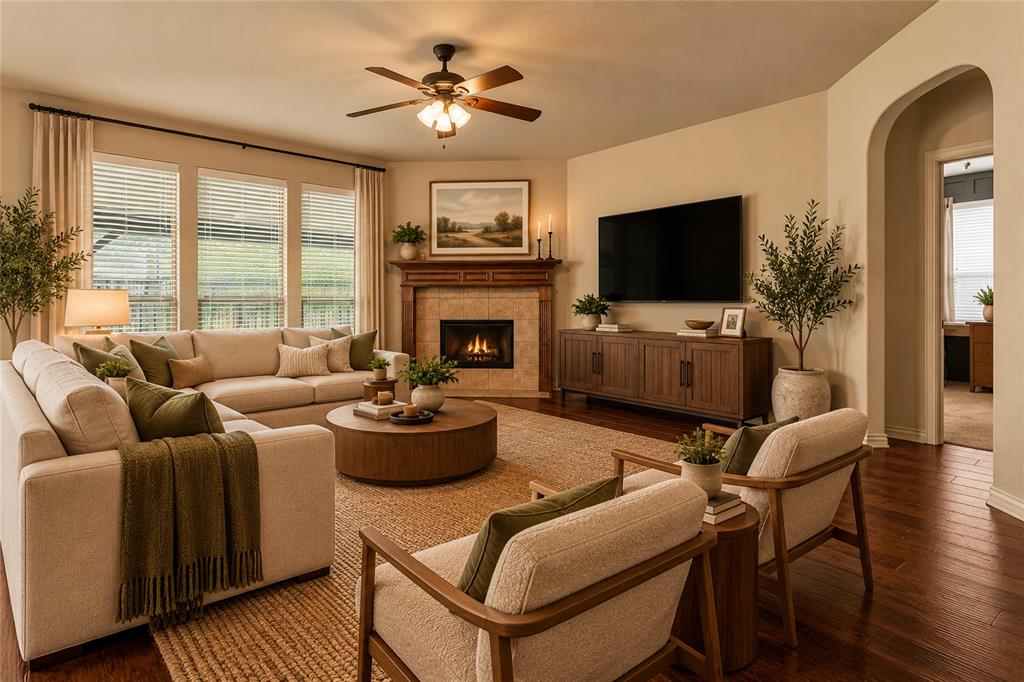 Living area has a wood burning fireplace and windows to the covered patio. Virtually staged.