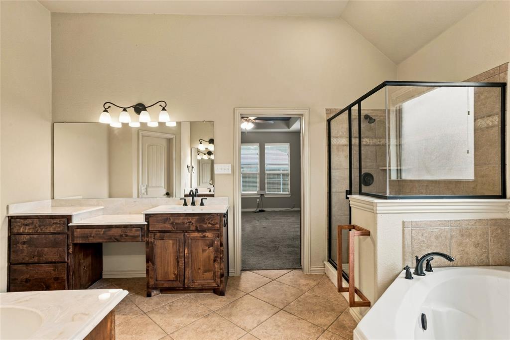 Ensuite primary bath with separate vanities.