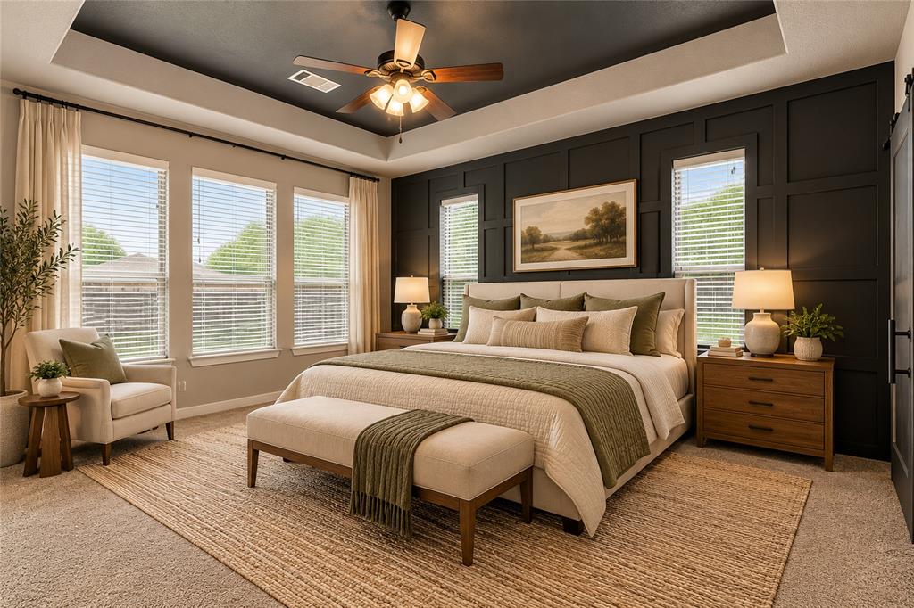 Primary bedroom with accent wall is large enough for a sitting area. Virtually staged.