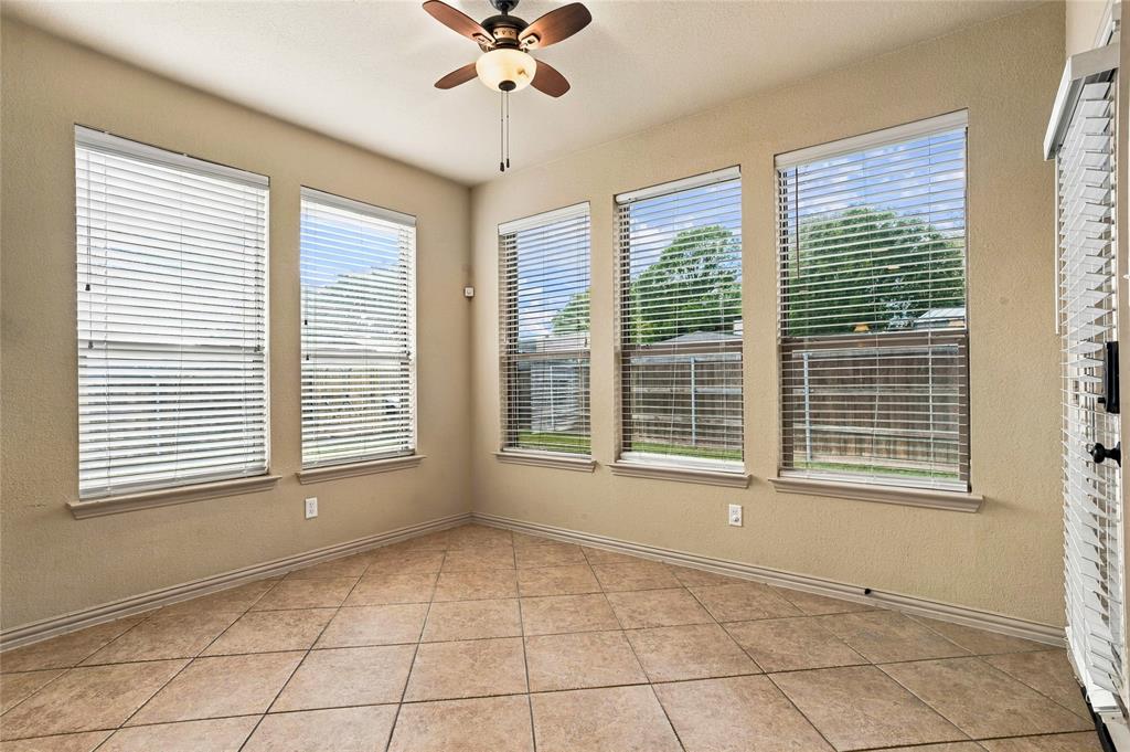 Breakfast area with lots of light and a view to the covered patio.