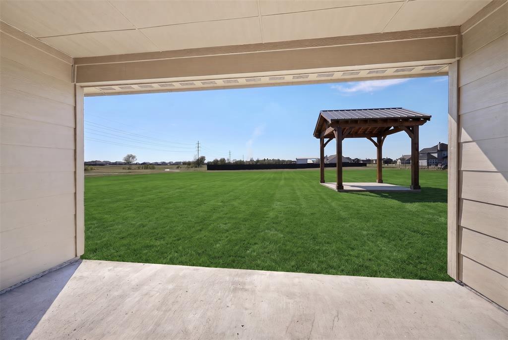 Virtually staged back patio and Pergola