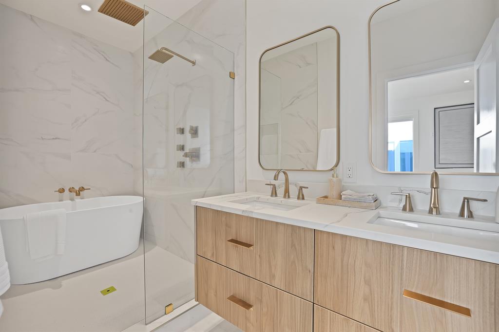 Bathroom with vanity and independent shower and bath