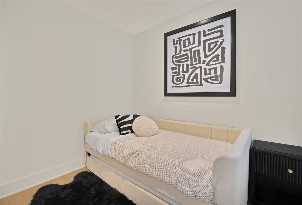 Bedroom with wood-type flooring
