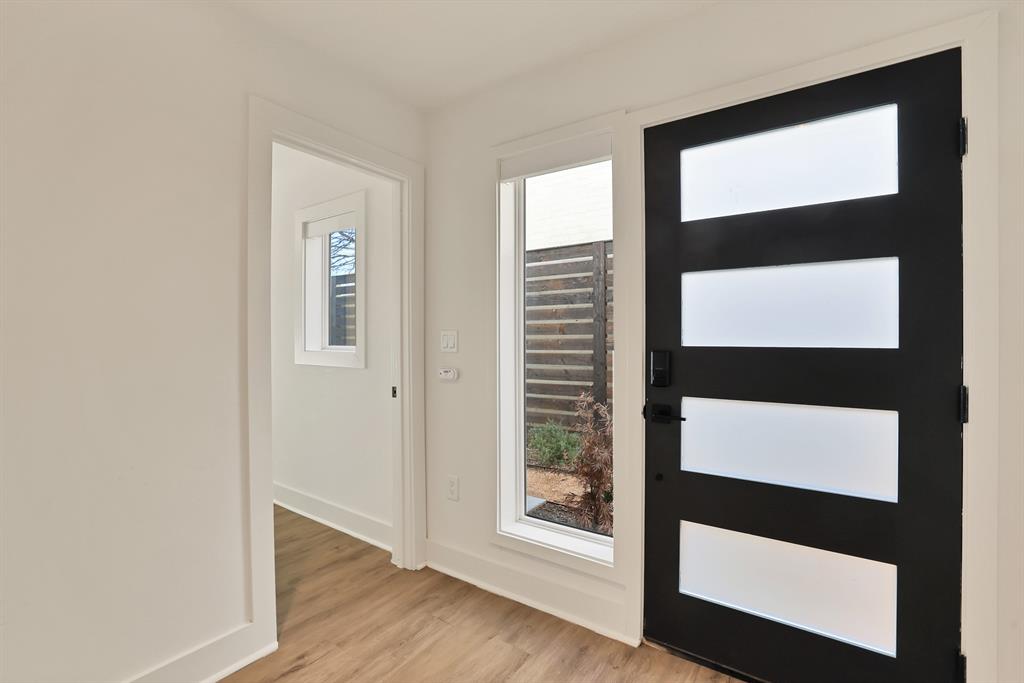 Entryway with light hardwood / wood-style flooring