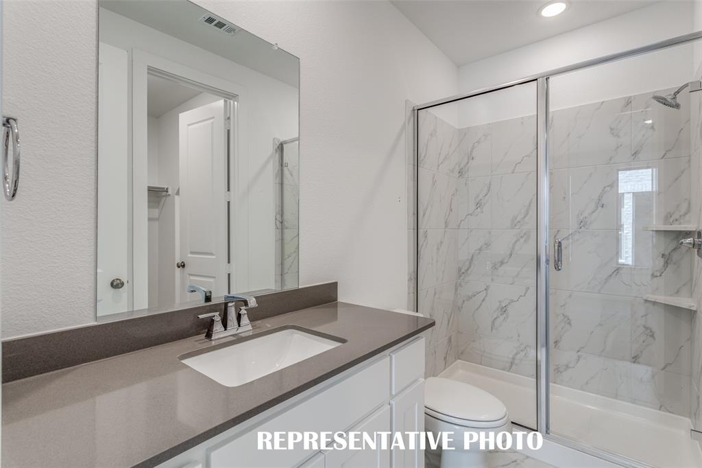 Guests will love getting ready in any of the gorgeous guest baths featured in this outstanding home!  REPRESENTATIVE PHOTO