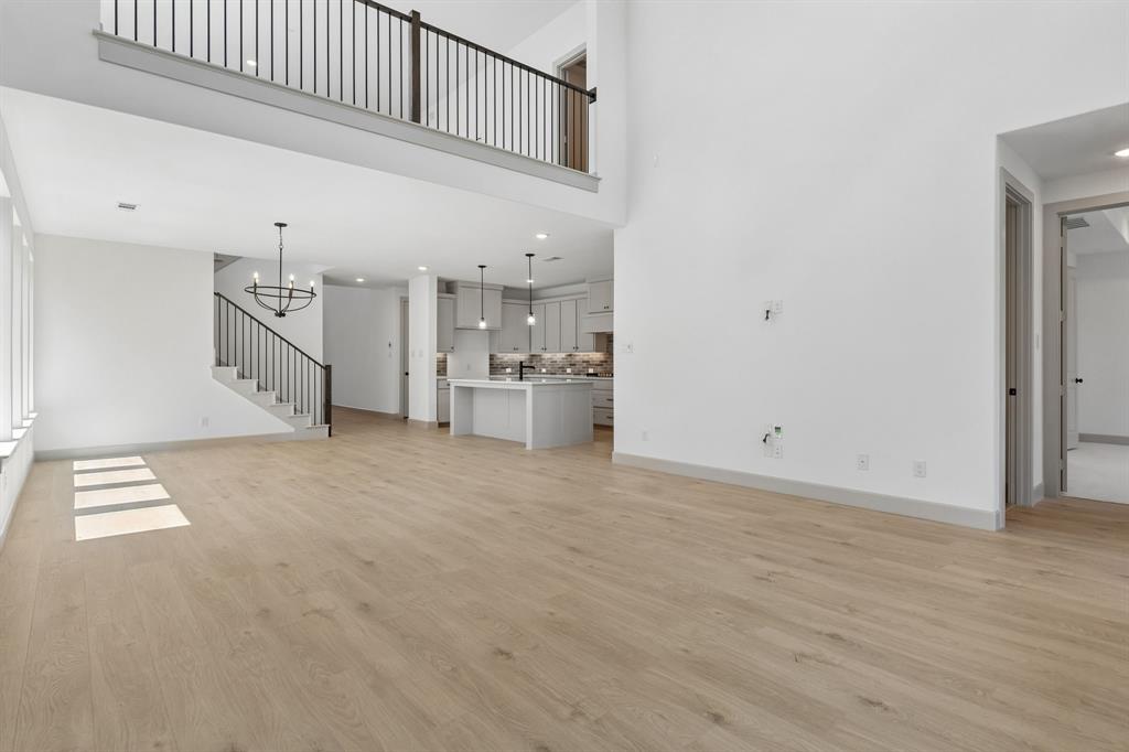 With the family room open to the game room above, you'll enjoy multi-level entertainment zones in this dream home!