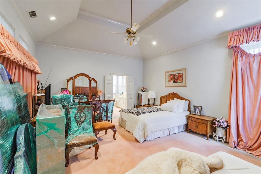 Vaulted ceiling featuring a central brass-finish ceiling fan and recessed lighting