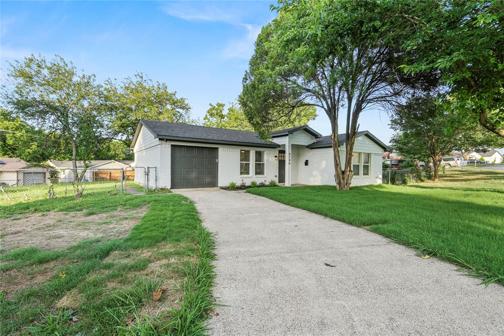 View of front facade featuring an attached garage, asphalt driveway, and a shingled roof View of front facade featuring an attached garage, asphalt driveway, and a shingled roof