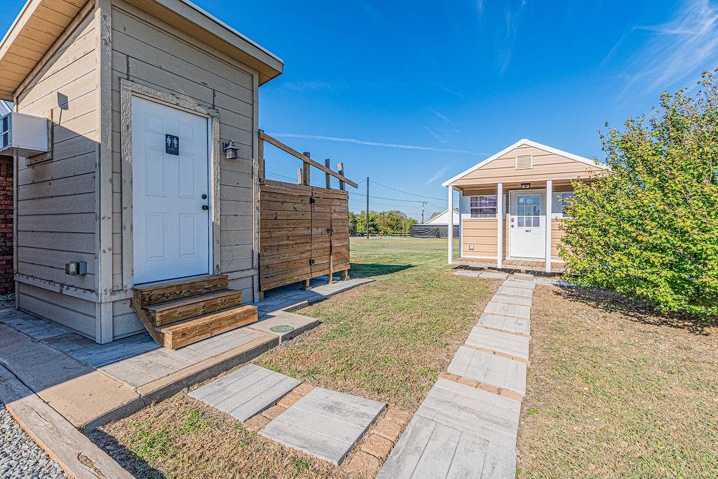 Outdoor bathroom and additional building
