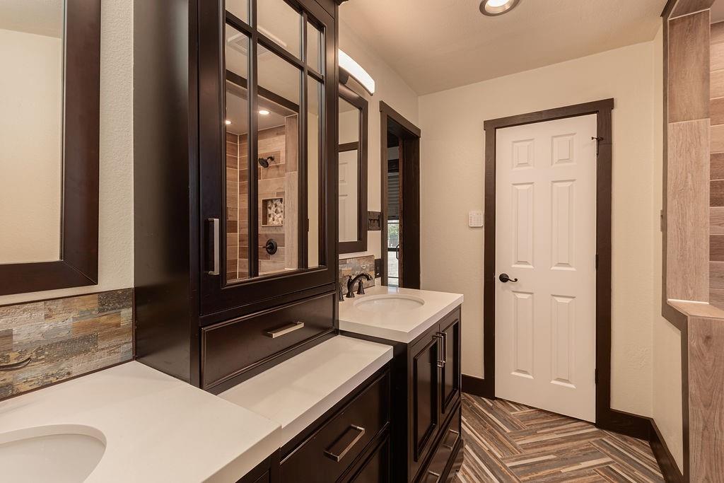 The primary bathroom vanity has 2 sinks and plenty of storage.