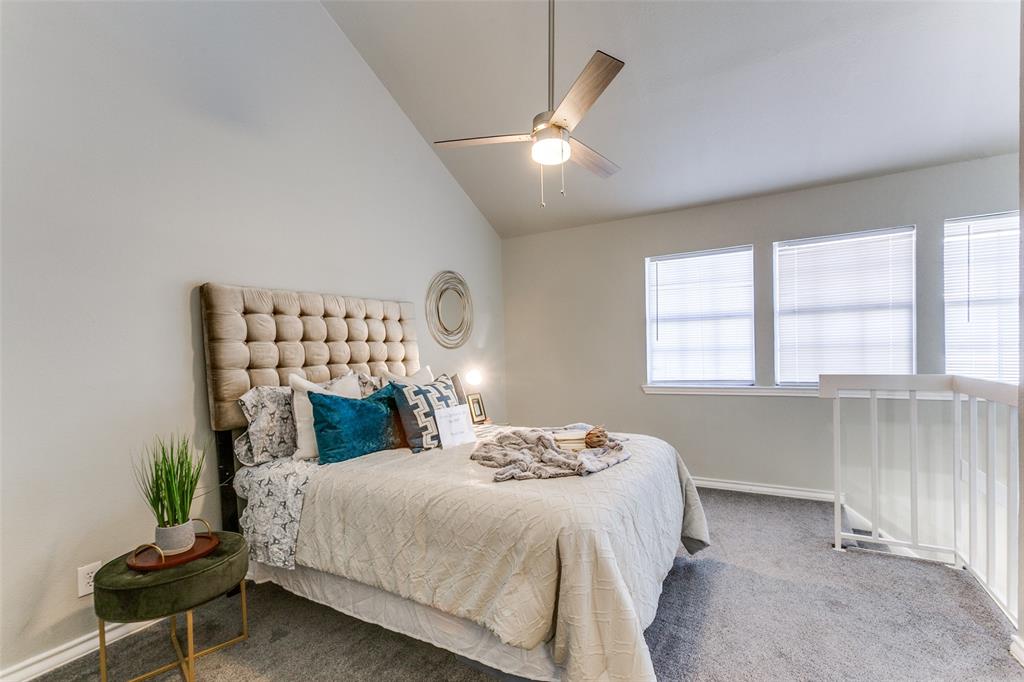 Vaulted ceilings, three paneled windows, and a ceiling fan with integrated lighting