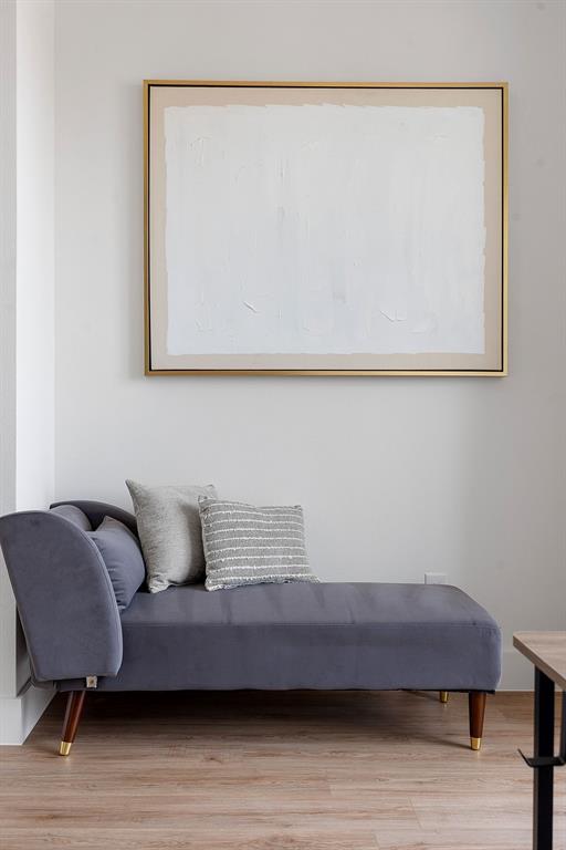 Neutral wall finish and light-tone wood-finish flooring