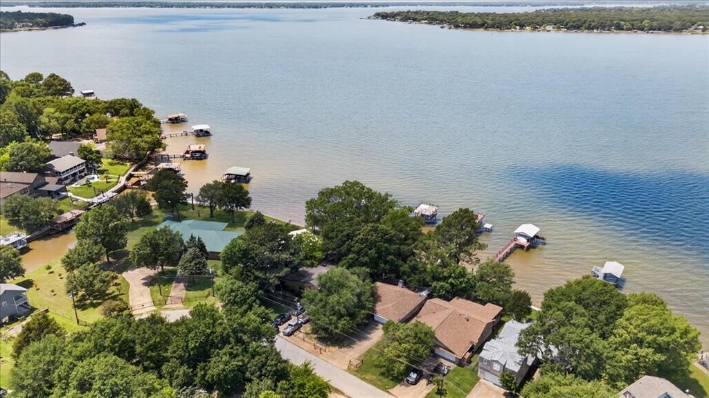 Waterfront lot featuring extensive shoreline, private boat dock, and mature trees
