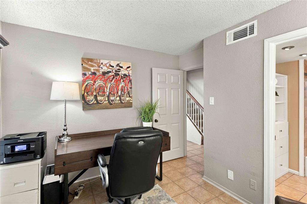 Ceramic tile flooring, six-panel interior door, and built-in storage cabinetry