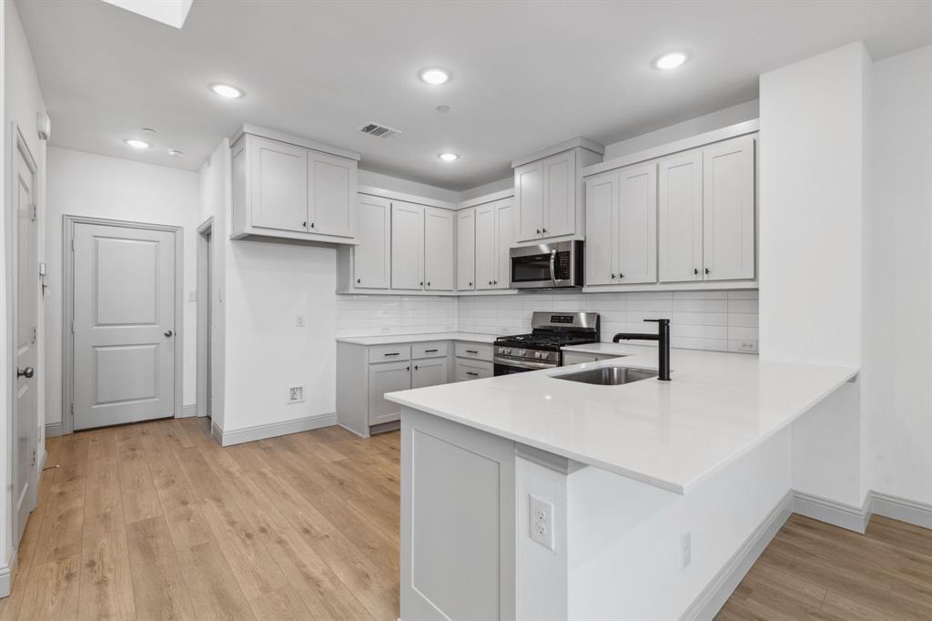 The kitchen peninsula does double duty as the perfect place for a quick family meal or homework station! REPRESENTATIVE PHOTO The kitchen peninsula does double duty as the perfect place for a quick family meal or homework station! REPRESENTATIVE PHOTO