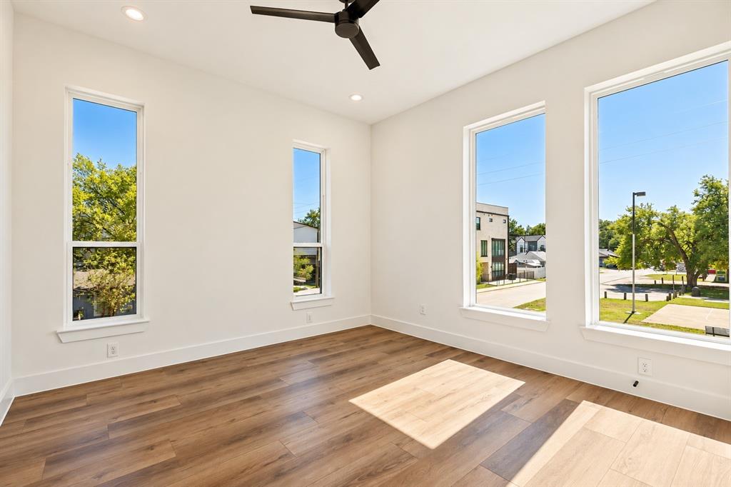 Recessed lighting, wood-finish flooring, and a ceiling fan