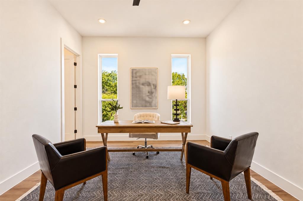 Recessed lighting, wood-finish flooring, and white walls