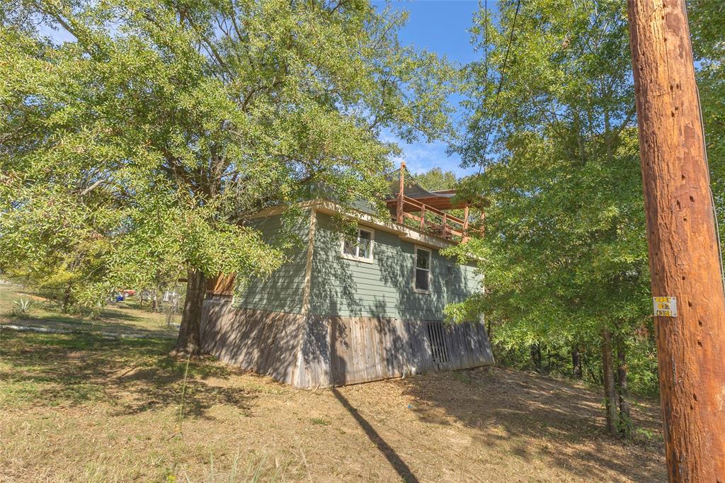 Exterior view of home set among mature trees