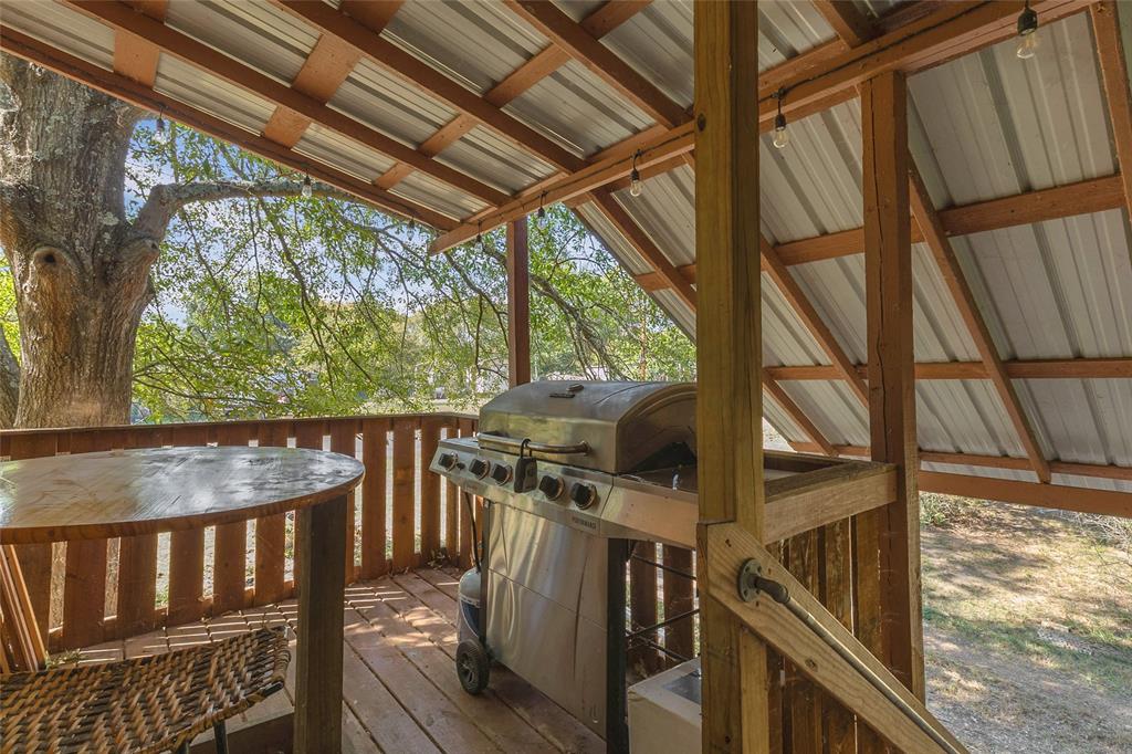 Covered deck with metal roof and space for a grill