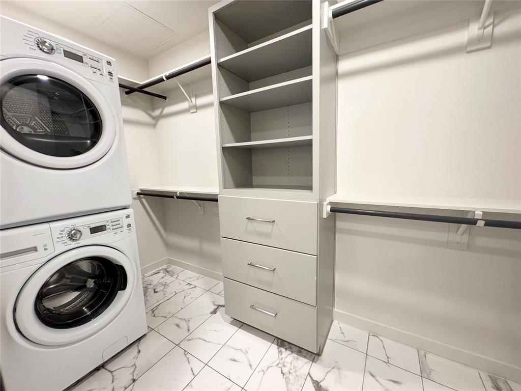 Laundry area with stacked washer / dryer
