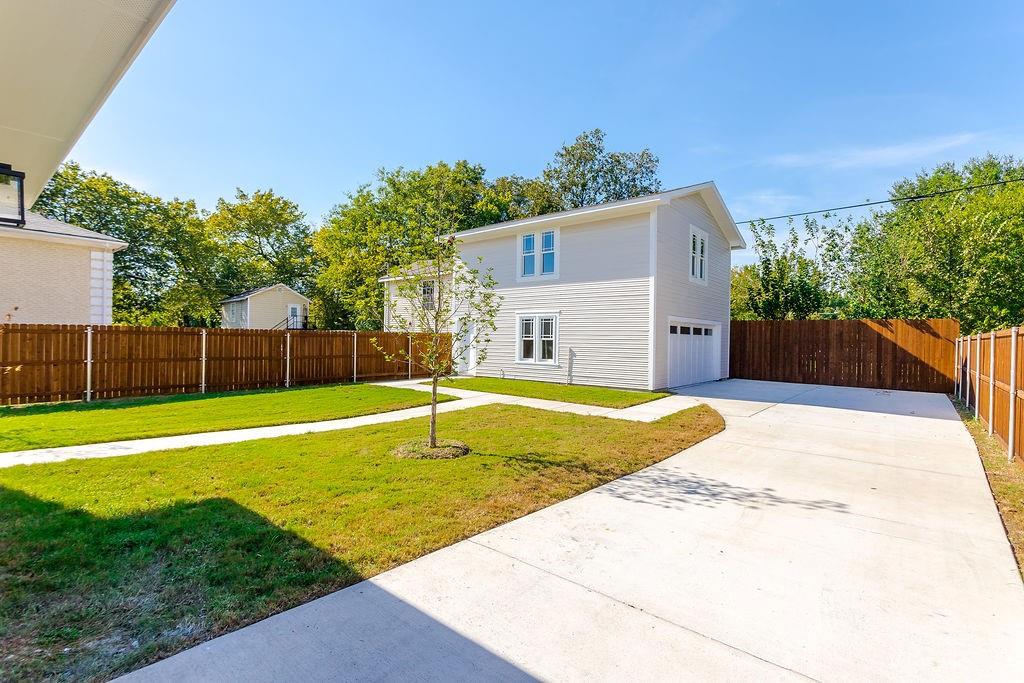 Detached 2-car garage with 648 sq ft of finished, climate-controlled bonus space above — perfect for a home office, studio, workout room or private living room