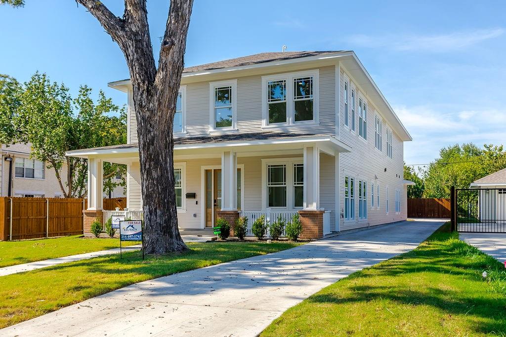 Craftsman detailing, covered front porch, and professional landscaping: 4631 Junius St, Dallas TX