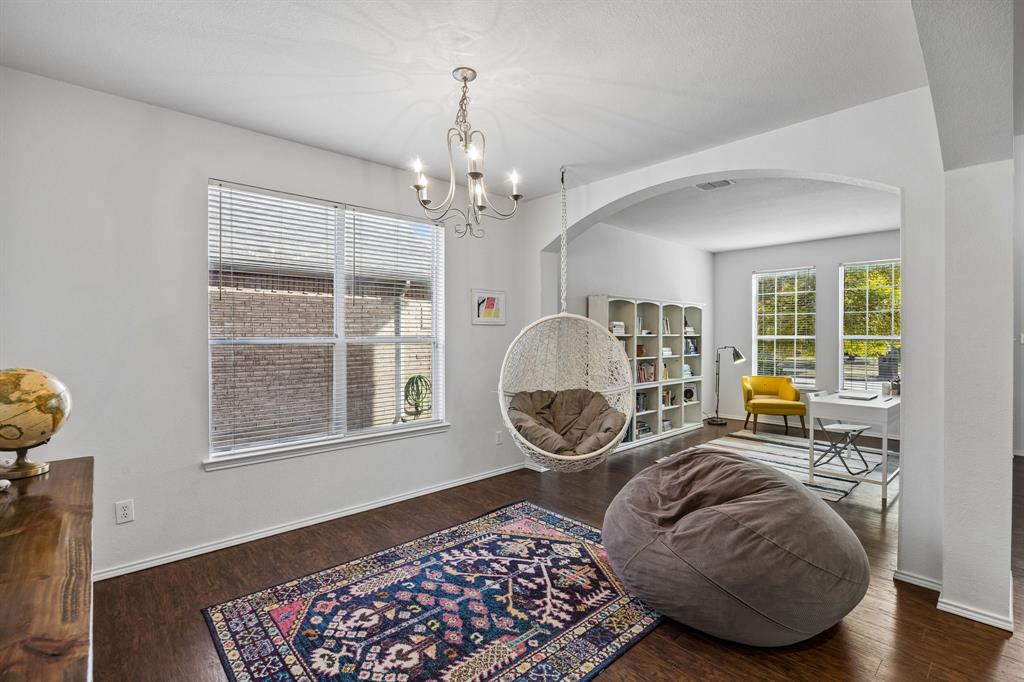 A delightful retreat designed for unwinding, this inviting family area features a large enough space to accommodate oversized seating. Natural light streams through the windows, creating a cozy atmosphere for reading, relaxing, or enjoying a quiet moment away from the day's activities.