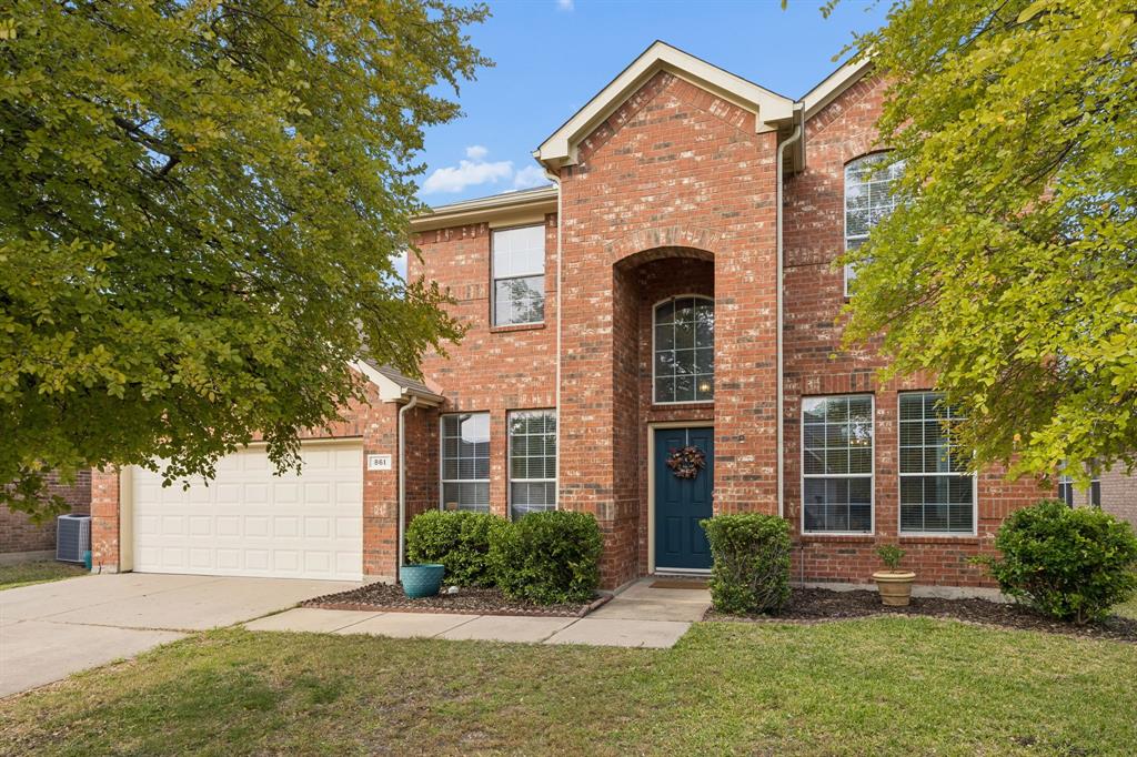 This Grand Heritage home has an abundance of character and curb appeal that will impress!! A striking red-brick façade, classic architectural lines, and a charming covered entry create an inviting first impression. Mature trees provide a beautiful natural canopy, while manicured landscaping and a rich blue front door welcome your family and friends to your new home!