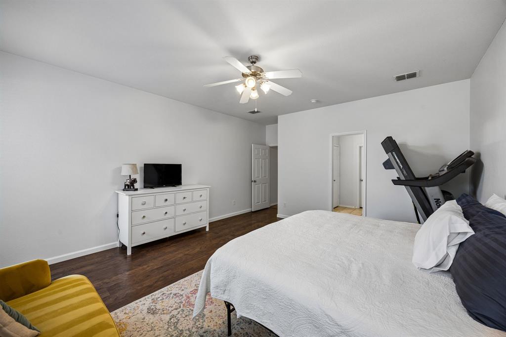 The primary bedroom's functionality and the generous floor area provides flexibility for different furniture arrangements and everyday needs. Its clean, neutral finishes offer a versatile backdrop for a personalized retreat.