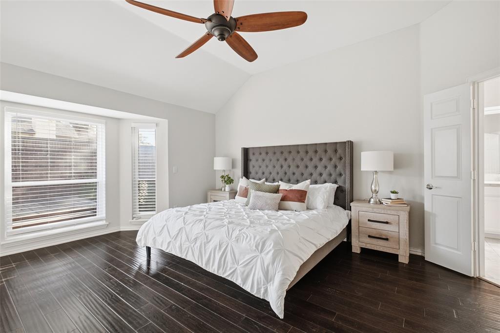 The bay window fills the primary bedroom with soft natural light, and there’s plenty of room to create your own sanctuary.