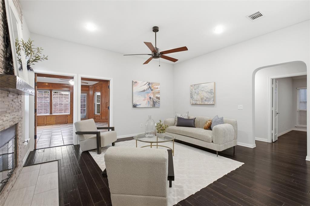 French doors from the living room open to the sunroom, letting natural light and easy flow carry from room to room.