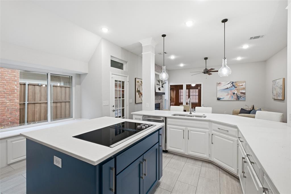 Bright, white and wide open. The generous counter space and garden-view windows make weeknight dinners and holiday hosting a pleasure.