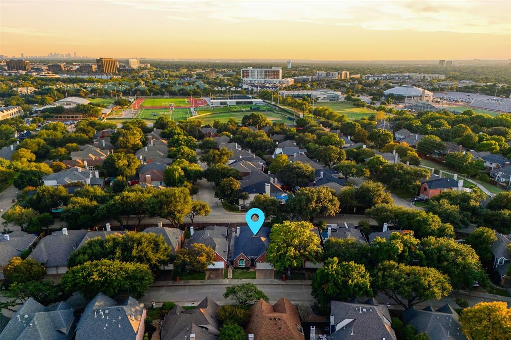 An aerial view shows the home’s tree-lined setting, minutes from parks, shopping, the and Tollway.