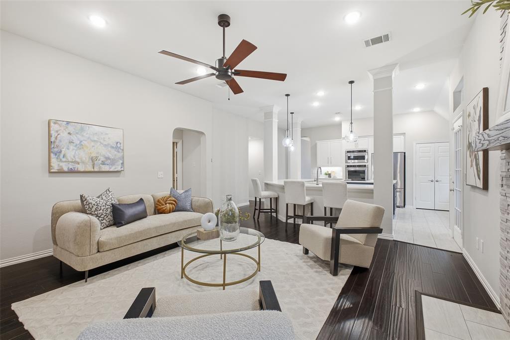 Open-concept living at its best. Cook, gather and unwind in one connected space under a modern ceiling fan and soft recessed lighting.