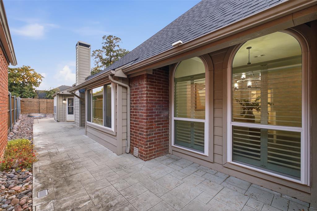A stamped-concrete courtyard wraps the back of the home, giving you private outdoor living right outside your door.