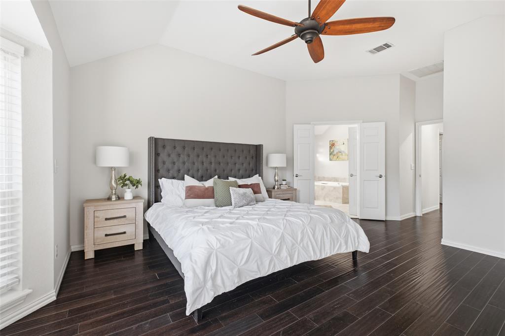 Double doors lead from the primary bedroom to a spa-style ensuite. A peaceful end to every day.