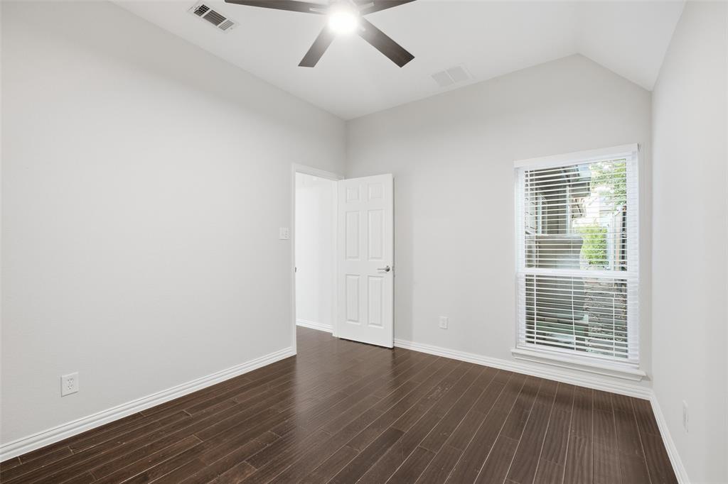 Natural light pours into the third bedroom. A perfect guest room, nursery or work-from-home space.