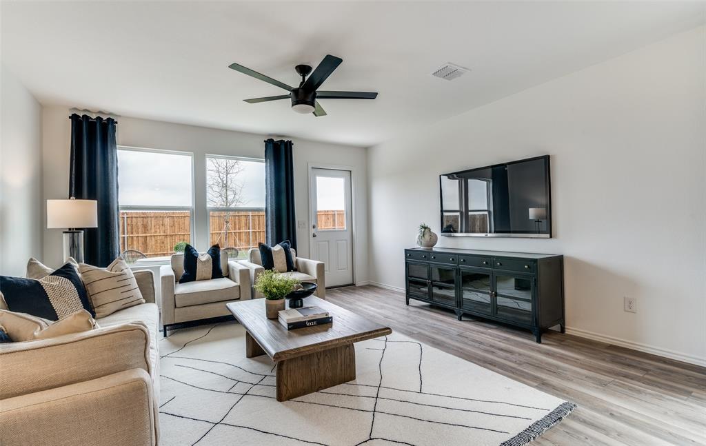 *Model Representation - Spacious gathering room with large windows
