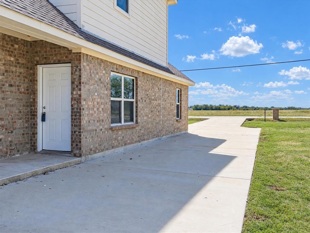 Back Patio opening to large grass backyard